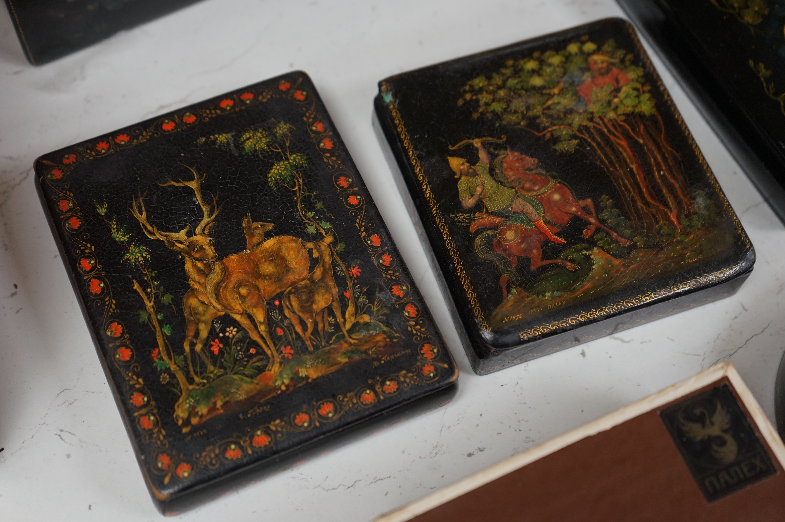 Six late 19th / early 20th century Russian lacquer boxes to include a circular example, largest 15cm wide. Condition - good